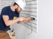 Electrician working in kitchen