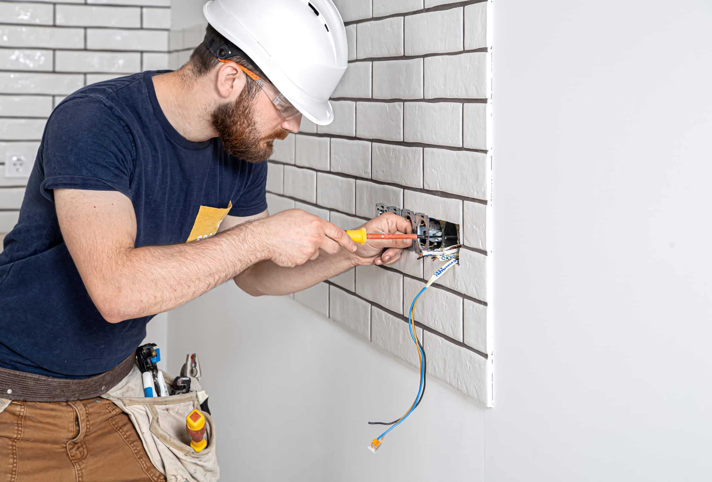 Electrician working in kitchen